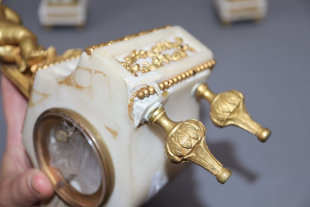 A 19th century ormolu clock garniture, with angelic surmount